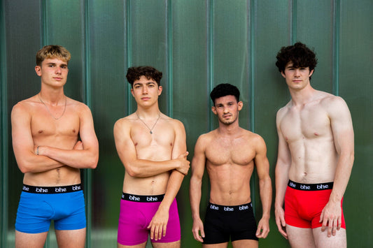 4 sporty young men of various sizes, wearing blue, purple, black and red boxer shorts from the 'ohe bamboo underwear range