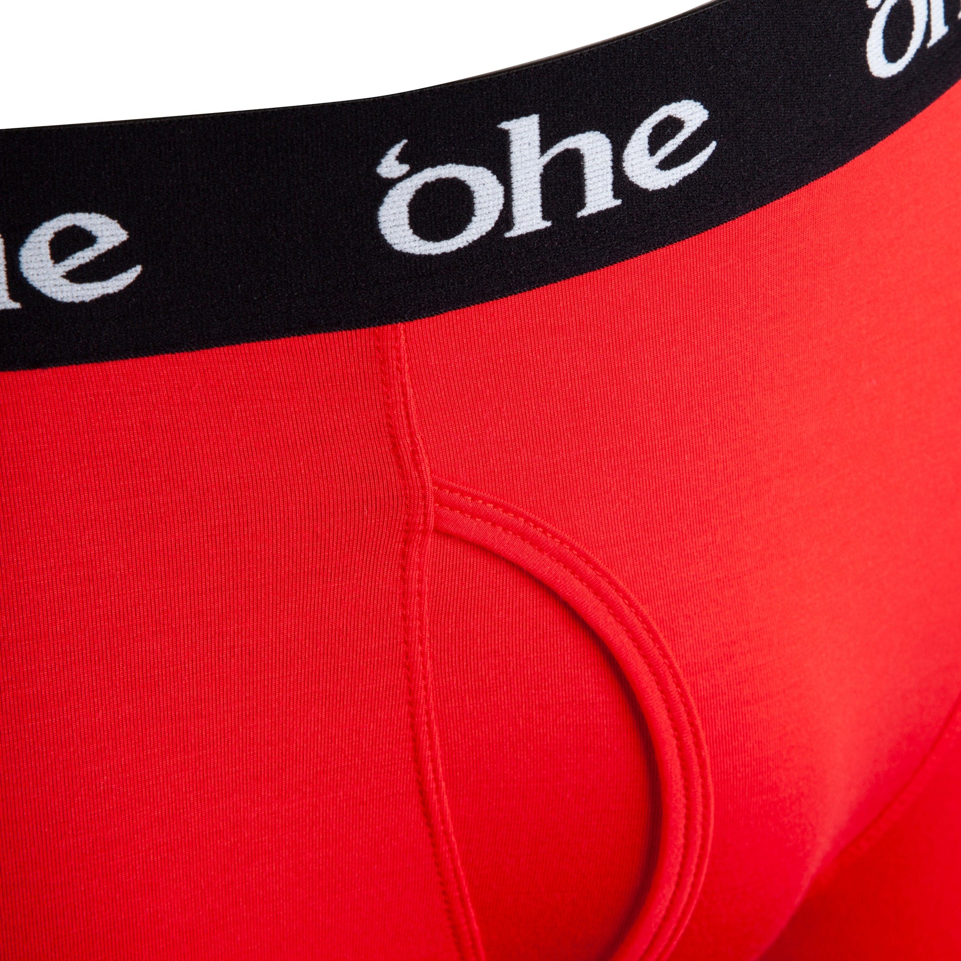 Close up view of fly and waistband on red men's bamboo boxer shorts from 'ohe